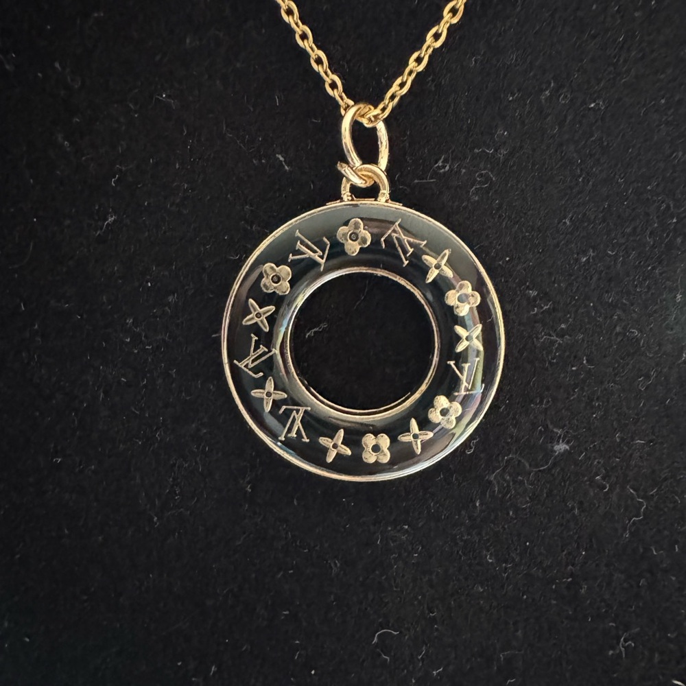 LV Gold toned Circle Pendant